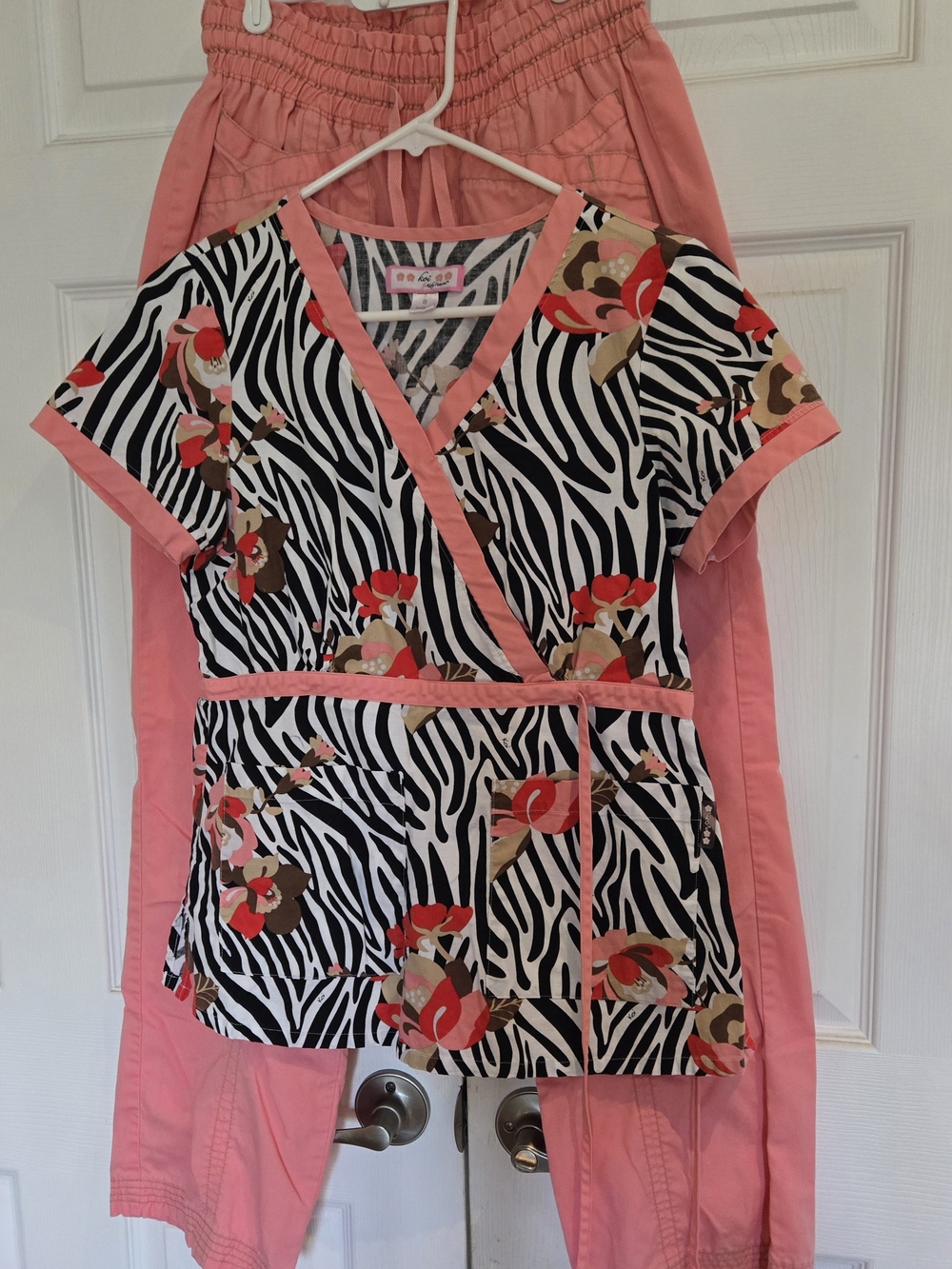 koi Black & White Zebra Print Side Tie Topwith Coral Trim and Red Floral Accents